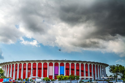 Low angle view of building against cloudy sky