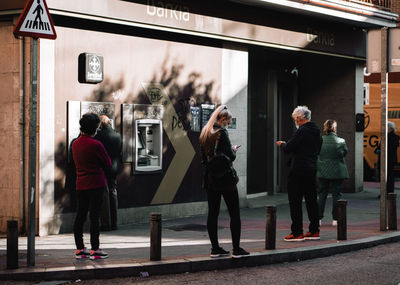 People walking on street in city