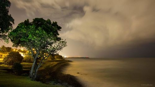 Scenic view of sea against cloudy sky