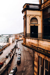 View of city street and buildings against sky