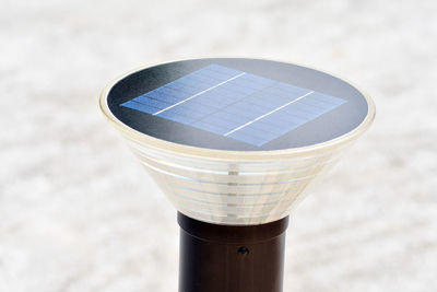 Close-up of solar street light on footpath