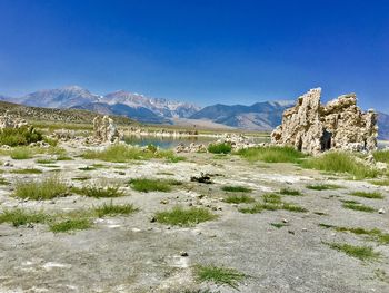 Scenic view of mountains against clear blue sky