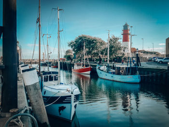 Boats moored at harbor