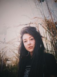 Portrait of woman against plants