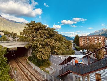 High angle view of canal amidst buildings against sky