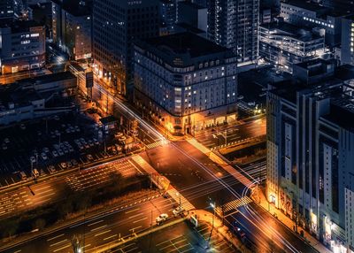 Aerial view of illuminated city at night