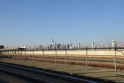 View of bridge in city against clear sky