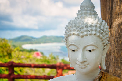 Close-up of statue against sky