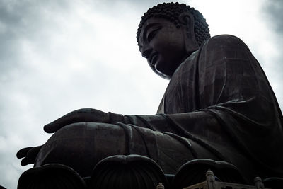 Low angle view of statue against sky