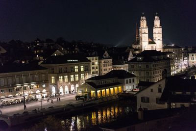 Reflection of illuminated buildings in city at night