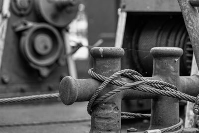 Close-up of rope tied on metal railing