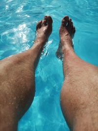 Low section of man in swimming pool