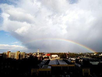Rainbow over city