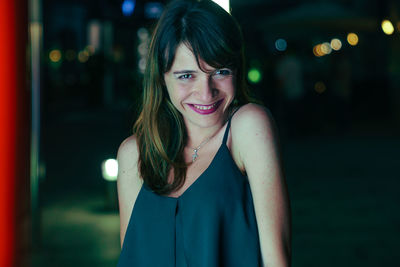 Close-up portrait of a smiling young woman