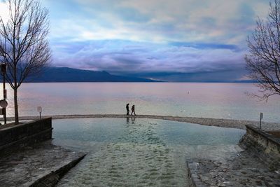 Scenic view of lake against sky during sunset