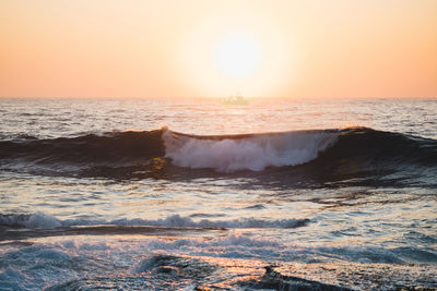 Scenic view of sea at sunset