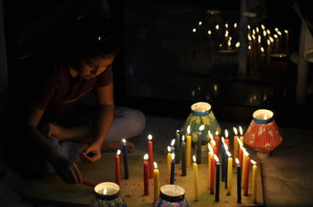 LOW ANGLE VIEW OF WOMAN IN ILLUMINATED ROOM