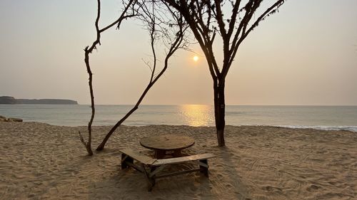 Scenic view of beach against sky during sunset