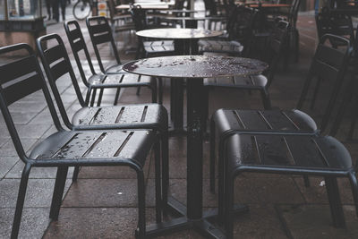 Empty chairs and tables in cafe