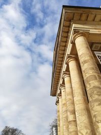 Low angle view of historical building against cloudy sky