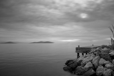 Scenic view of sea against cloudy sky