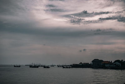 Scenic view of sea against sky at dusk