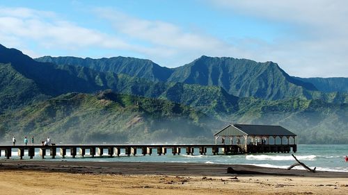 Hanalei pier in bay against mountains