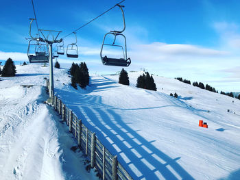 Snow caped landscape with lift for skiing in austria 