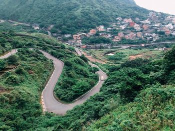 High angle view of road amidst trees in forest