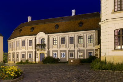 Building by street against clear sky