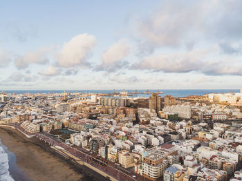 High angle view of townscape against cloudy sky