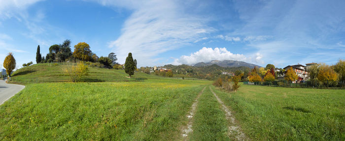 Panoramic shot of agricultural field against sky