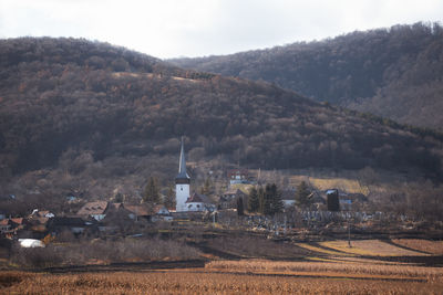 High angle view of townscape and mountains against sky