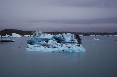 Scenic view of frozen sea against sky