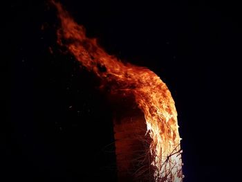 Close-up of bonfire against black background