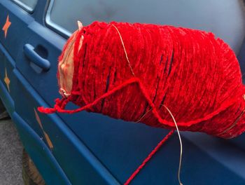 High angle view of red leaf hanging in car