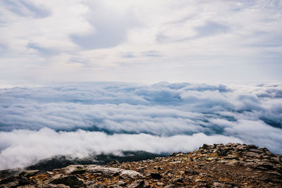 Scenic view of clouds over mountain against sky