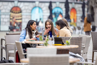 Group of people sitting at restaurant