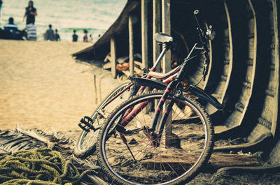 Bicycle by rope at beach