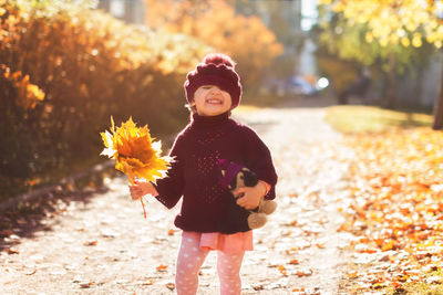 Portrait of girl standing outdoors