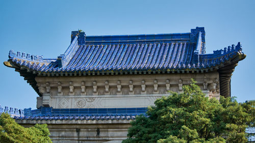 Low angle view of historical building against clear blue sky