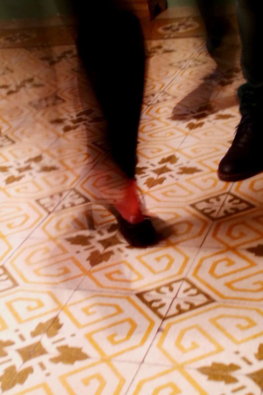 indoors, low section, selective focus, human limb, floral pattern, high angle view, person, flooring, textile, limb