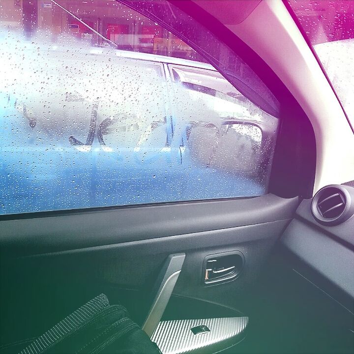 indoors, glass - material, mode of transport, transportation, window, car, vehicle interior, land vehicle, transparent, close-up, reflection, no people, car interior, windshield, part of, high angle view, travel, cropped, blue, day