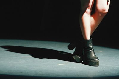 Low section of woman standing on floor