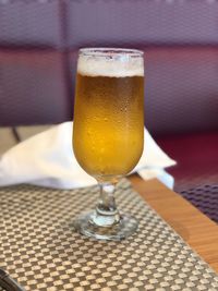 Close-up of beer in glass on table