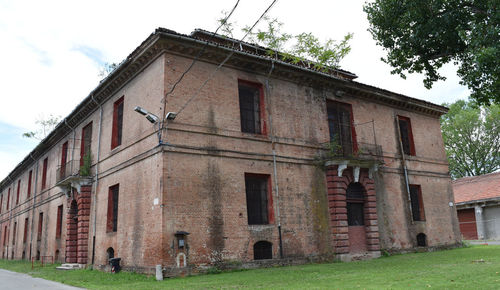 Low angle view of old building against sky