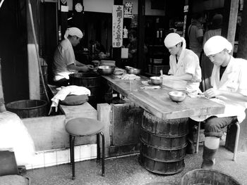 People working in restaurant at market