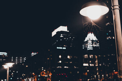 Illuminated street light at night