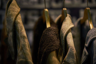 Close-up of clothing hanging on coathanger for sale in store