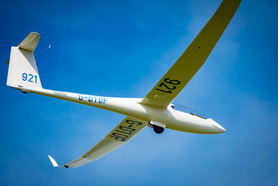 Low angle view of airplane against sky